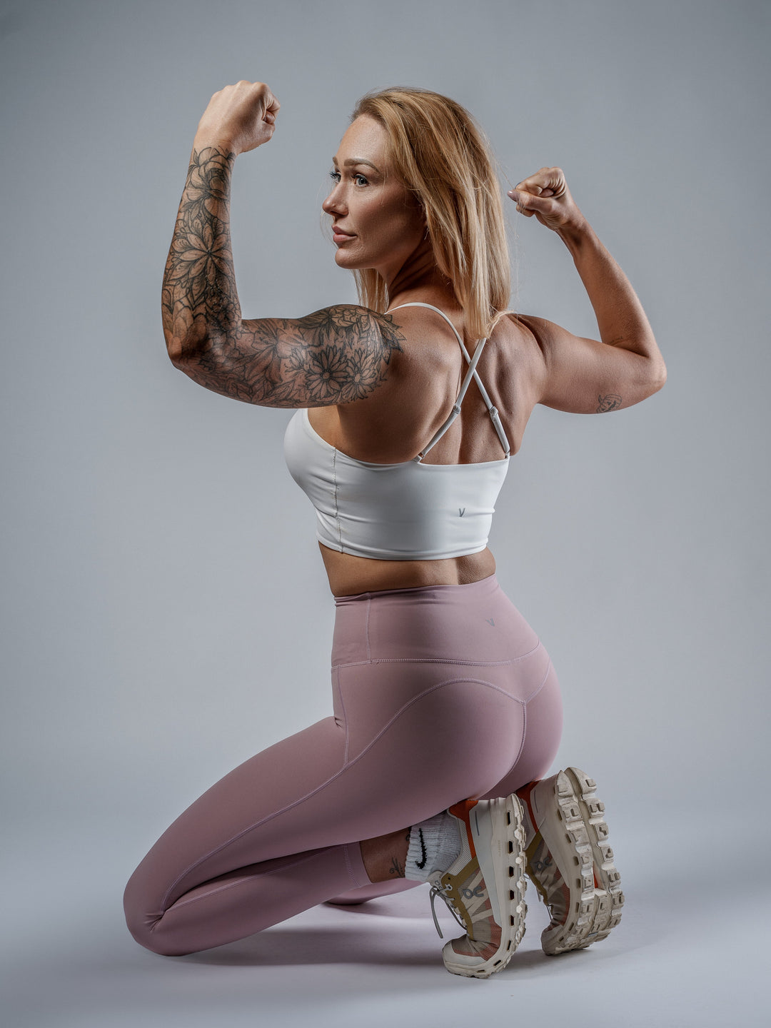 White Cut-Out Sports Bra worn by Leigha, cross-strap back view