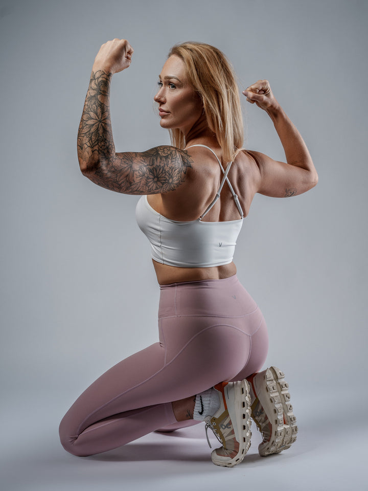 White Cut-Out Sports Bra worn by Leigha, cross-strap back view