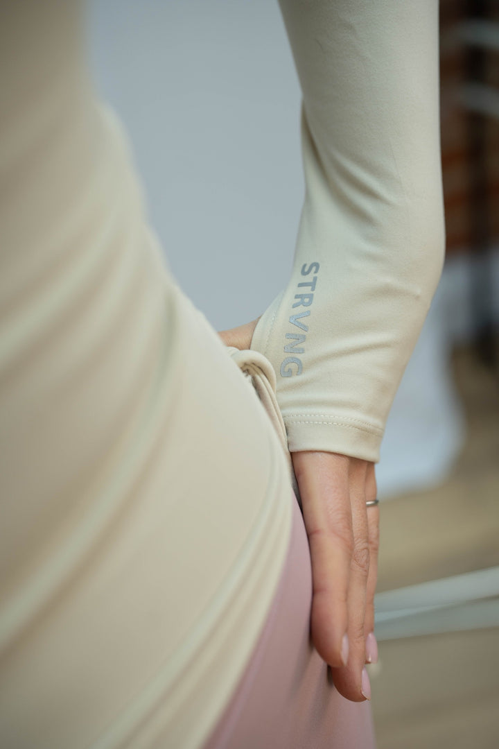 Beige Motion Ruched Top sleeve and thumbhole detail